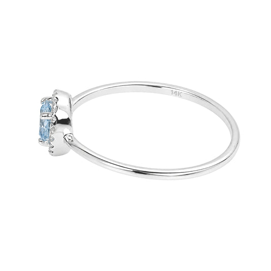 Blue Topaz and Diamond Birthstone Halo Ring