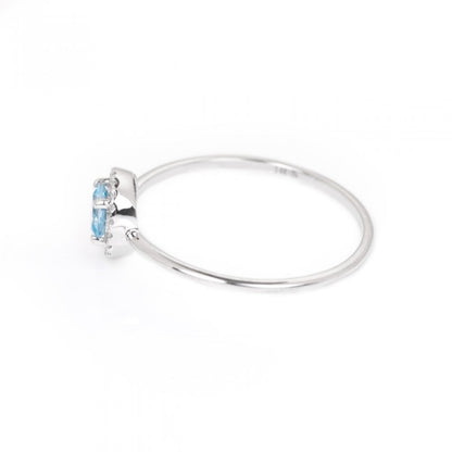 Blue Topaz and Diamond Birthstone Halo Ring